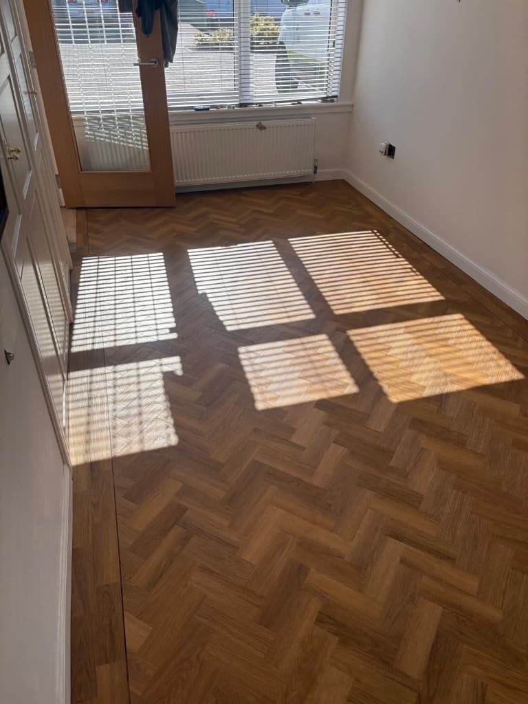 Herringbone LVT flooring installation with custom border — Parfait Flooring, Glasgow