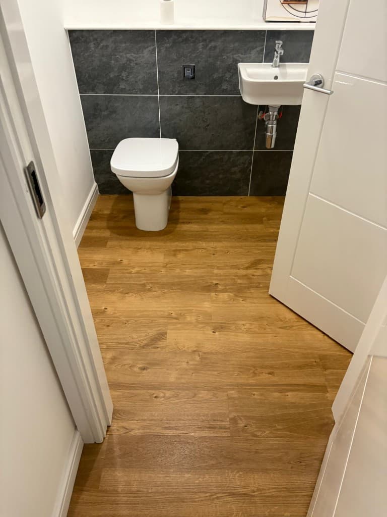Herringbone LVT flooring installation with custom border — Parfait Flooring, Glasgow