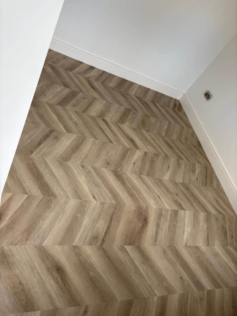 Herringbone LVT flooring installation with custom border — Parfait Flooring, Glasgow