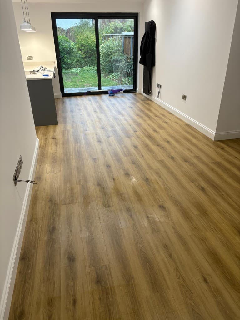Herringbone LVT flooring installation with custom border — Parfait Flooring, Glasgow