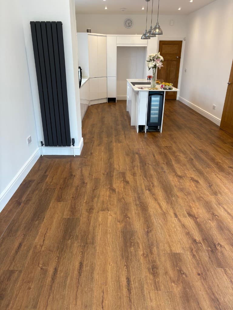 Herringbone LVT flooring installation with custom border — Parfait Flooring, Glasgow