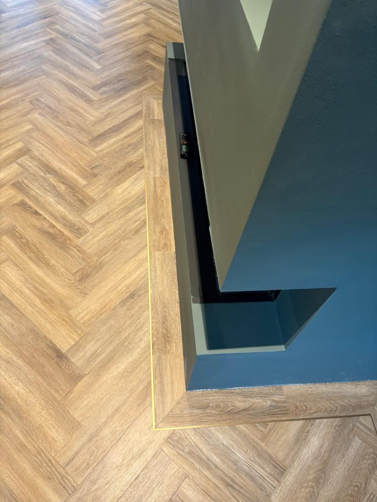 Herringbone LVT flooring installation with custom border — Parfait Flooring, Glasgow