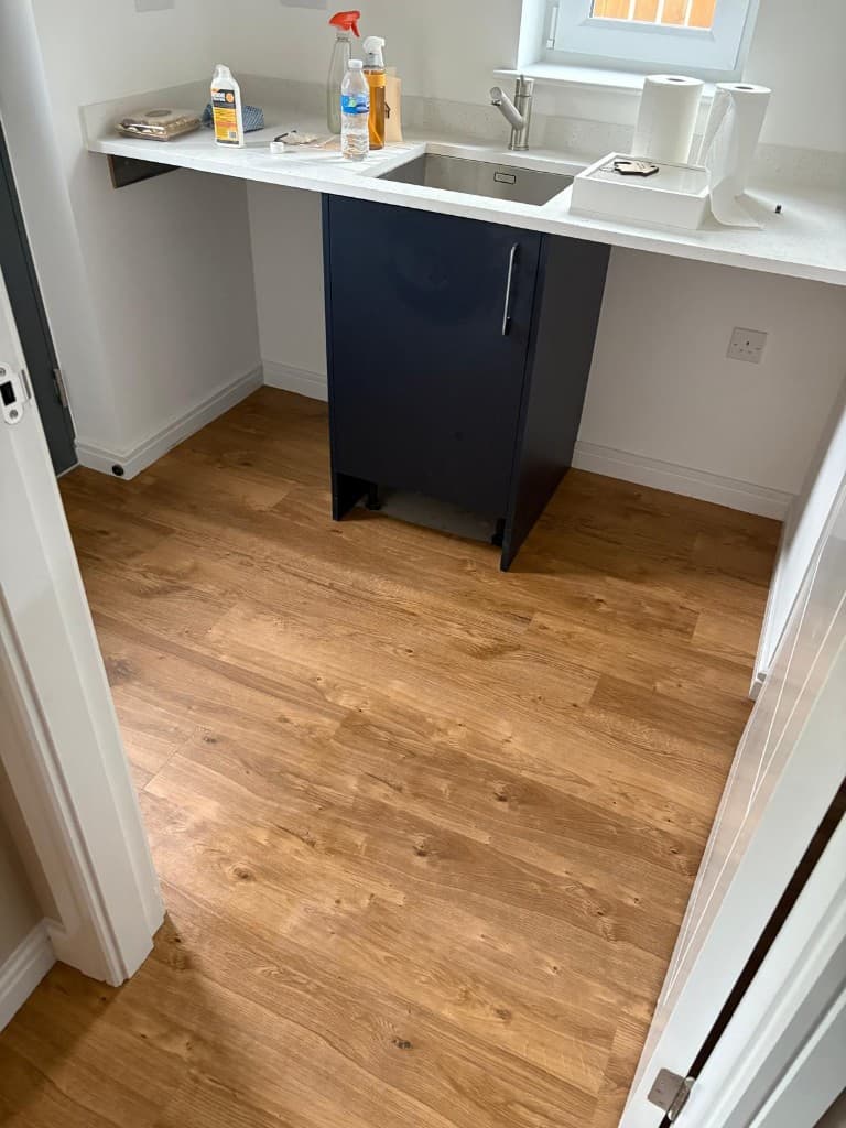 Herringbone LVT flooring installation with custom border — Parfait Flooring, Glasgow