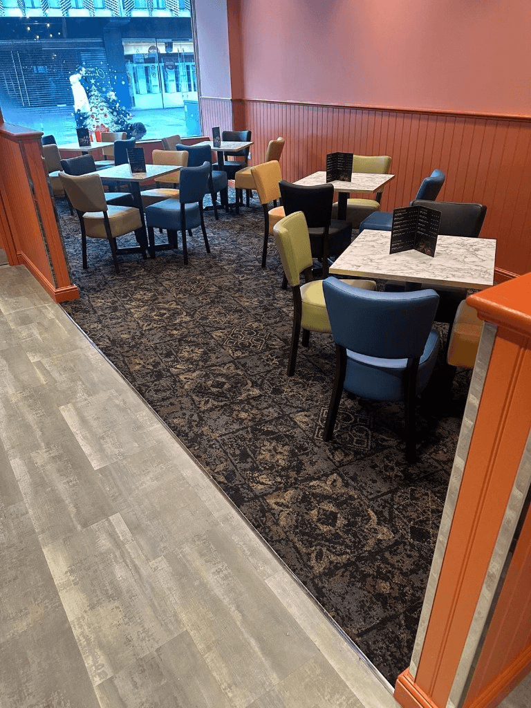 Commercial hospitality carpet tiling with wood-effect walkway transition — Parfait Flooring, Glasgow